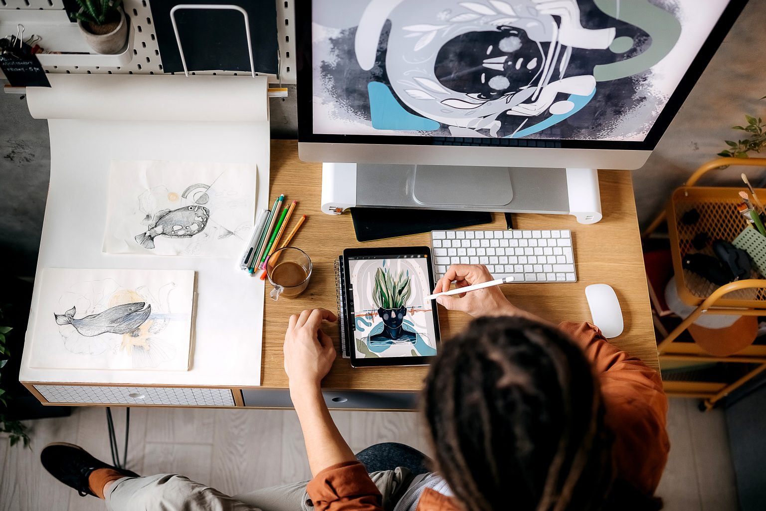 An illustrator working across tablet, sketches and screen