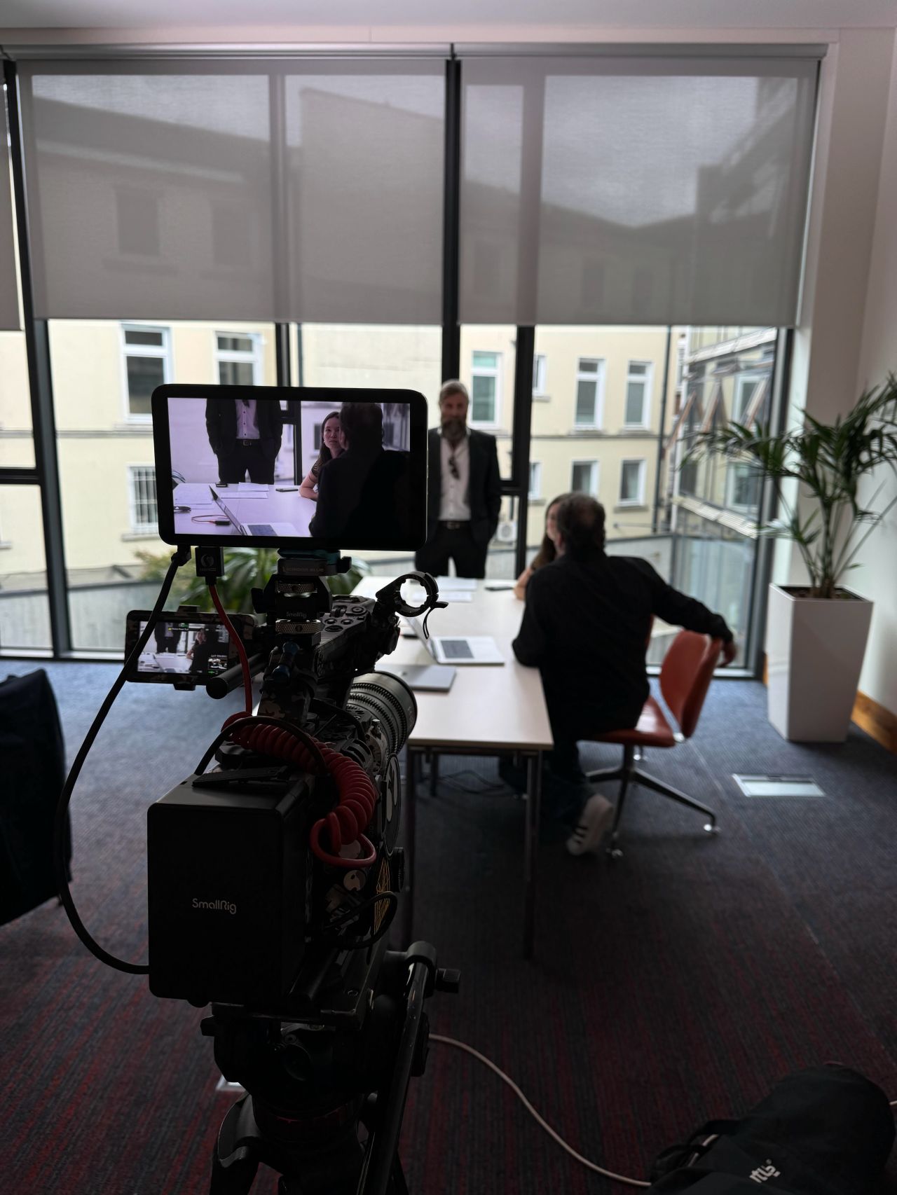 Camera and monitor set up to film a meeting-room scene for Chartered Accountants Ireland's Be the Boss